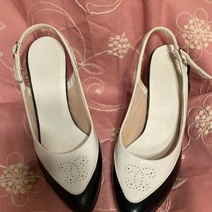 Black and white Spectators size 6 women’s 3” heels